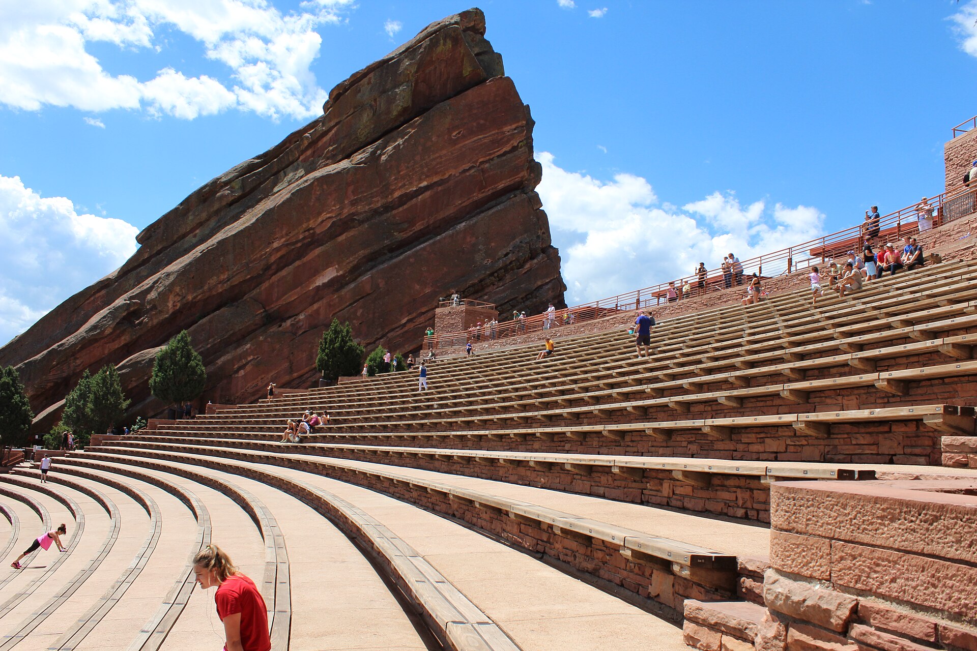 The giant red sandstone monolith and tiered seating of Red Rocks Amphitheatre in Morrison, Colorado